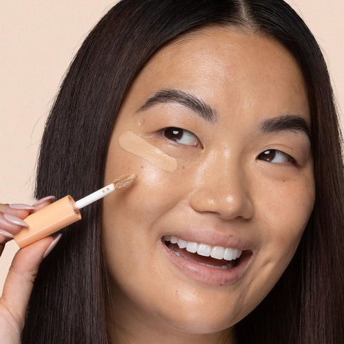 OUR DOE FOOT APPLICATOR IS SO PRECISE - add a small dot of concealer to the inner corner of your eye awaken your eyes! Also, add a small dot to your brow arch to give the ultimate lift. TIP: Use our F210 Vitamin Babe concealer brush to buff in your concealer for the ultimate flawless finish. 